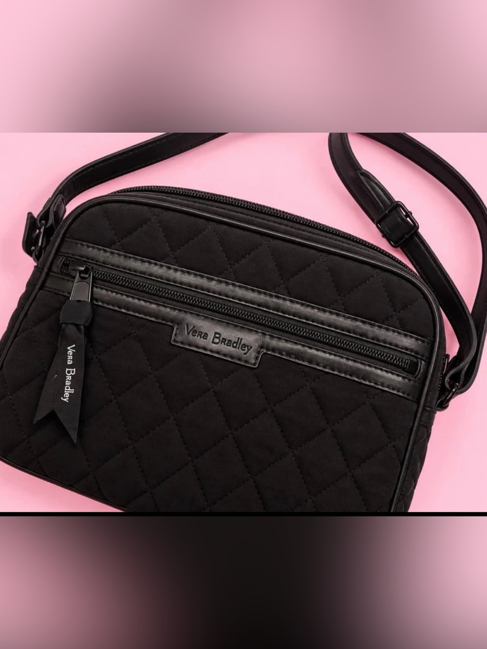 Vera Bradley black shoulder bag with floral print inside.